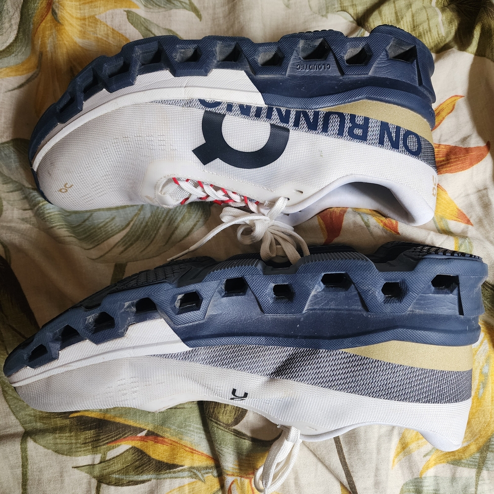 On Running White and Blue Sneakers with CloudTec Sole